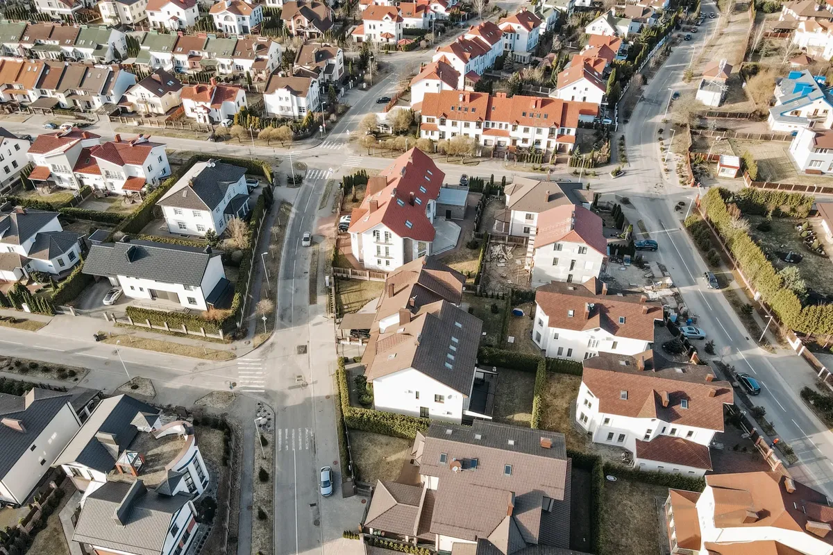 Aerial view of a suburban neighborhood with charming houses and clean streets.